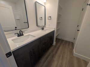 Bathroom with vanity and hardwood / wood-style floors