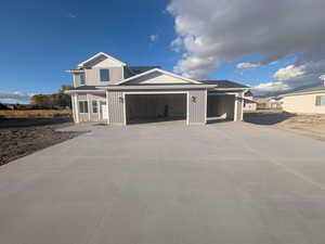 View of front facade featuring a garage