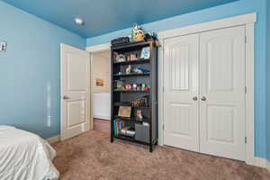 Bedroom featuring a closet and carpet