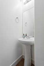 Bathroom featuring sink and tile patterned flooring