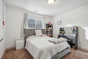 Bedroom featuring carpet flooring