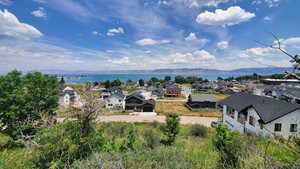 Birds eye view of property with Lake and mountain view