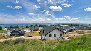 Exterior space with a water and mountain view