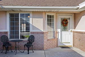 Doorway to property with a patio