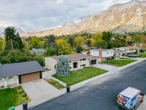 Birds eye view of property with a mountain view