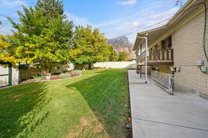 Backyard with a mountain view and a patio