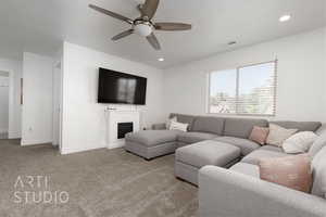 Living room featuring light colored carpet and ceiling fan