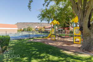 View of play area featuring a yard