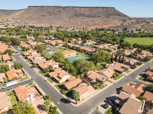 Aerial view with a mountain view looing NE.  Home is located on the corner at the bottom intersection