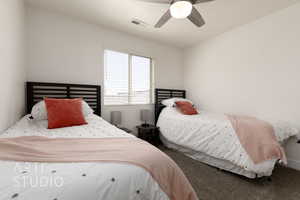 Bedroom featuring carpet flooring, touch lights with USB plugins, ceiling fan, twin beds with Purple XL twin mattresses