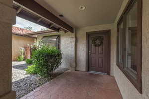 Entrance to property featuring a patio