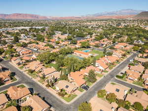 Aerial view with a mountain view. Home is located on the corner at the the top left intersection