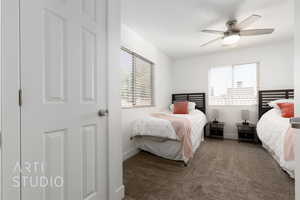 Bedroom featuring carpet flooring, touch lights with USB plugins, ceiling fan, twin beds with Purple XL twin mattresses