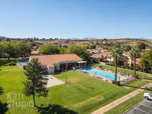 View of pool featuring a patio area, volleyball court, racquetball courts inside clubhouse, gym inside clubhouse