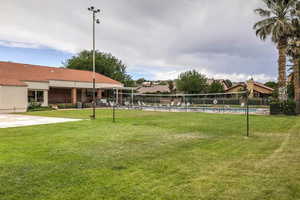 View of community volleyball court and swimming pool