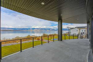 View of patio / terrace with a water view