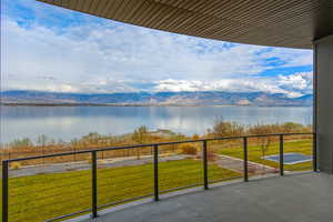 Balcony with a water and mountain view