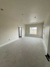 Empty room with a textured ceiling