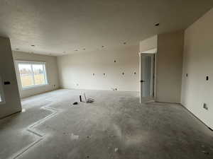 Empty room with a textured ceiling