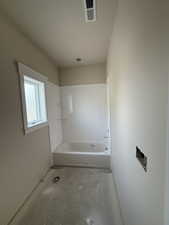 Bathroom featuring concrete floors