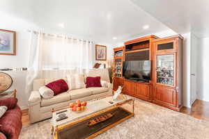 Living room with light hardwood / wood-style floors