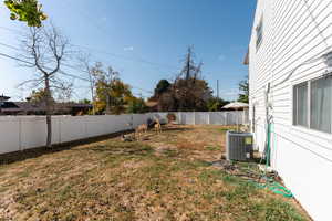 View of yard featuring central AC unit