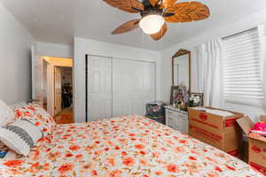 Bedroom with a closet and ceiling fan