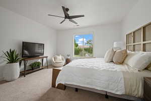 Carpeted bedroom with ceiling fan