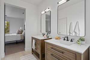 Bathroom with vanity and tile patterned floors