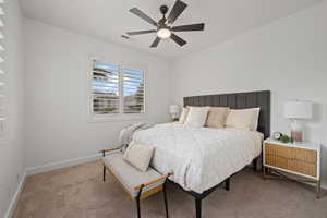 Bedroom with carpet flooring and ceiling fan