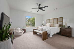 Carpeted bedroom with ceiling fan