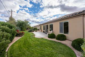 View of yard with a patio area