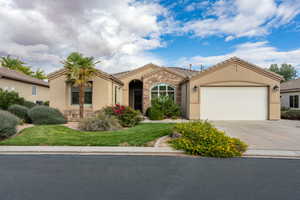 Mediterranean / spanish-style home featuring a garage