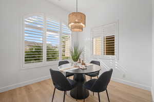 Dining area featuring light hardwood / wood-style floors and plenty of natural light