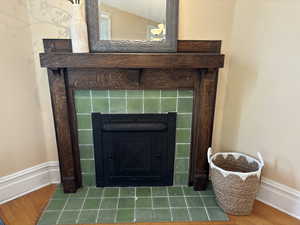 Tiled fireplace and wood mantel