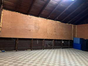 Large storage room above garage off mud room