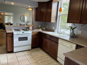 Kitchen with white appliances, & breakfast bar