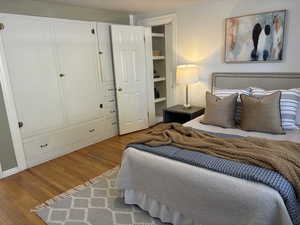 Bedroom with wall of built-in storage