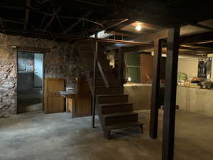 View of basement with high ceilings