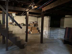 View of basement with high ceilings