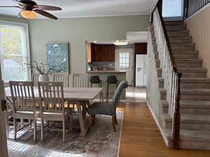 Dining space featuring open to kitchen with breakfast bar seating