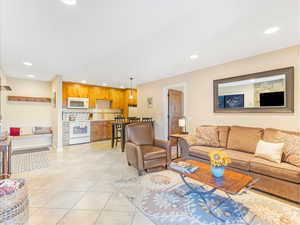 Tiled living room featuring sink