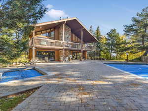 View of pool featuring a patio area and a deck