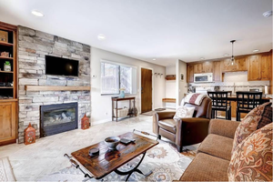 Tiled living room featuring a fireplace