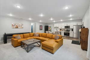 Downstairs living room with full kitchen and private outside entrance