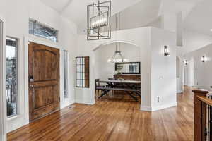 Foyer featuring high vaulted ceiling and light wood-type flooring