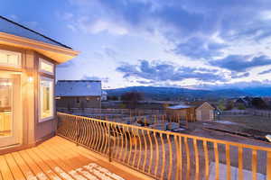 Wooden deck featuring a mountain view