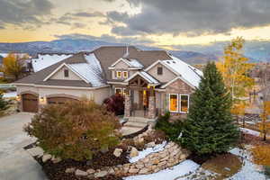 Craftsman inspired home featuring covered porch, a garage, and a mountain view