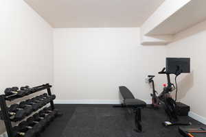 Exercise room featuring a textured ceiling