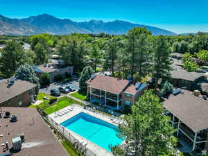 Birds eye view of property with a mountain view